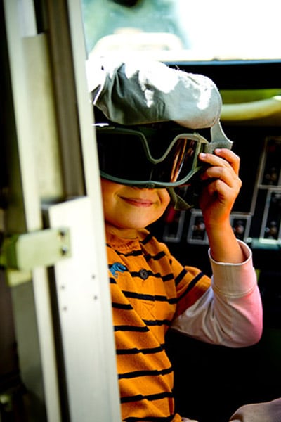 kid wearing goggles upside-down