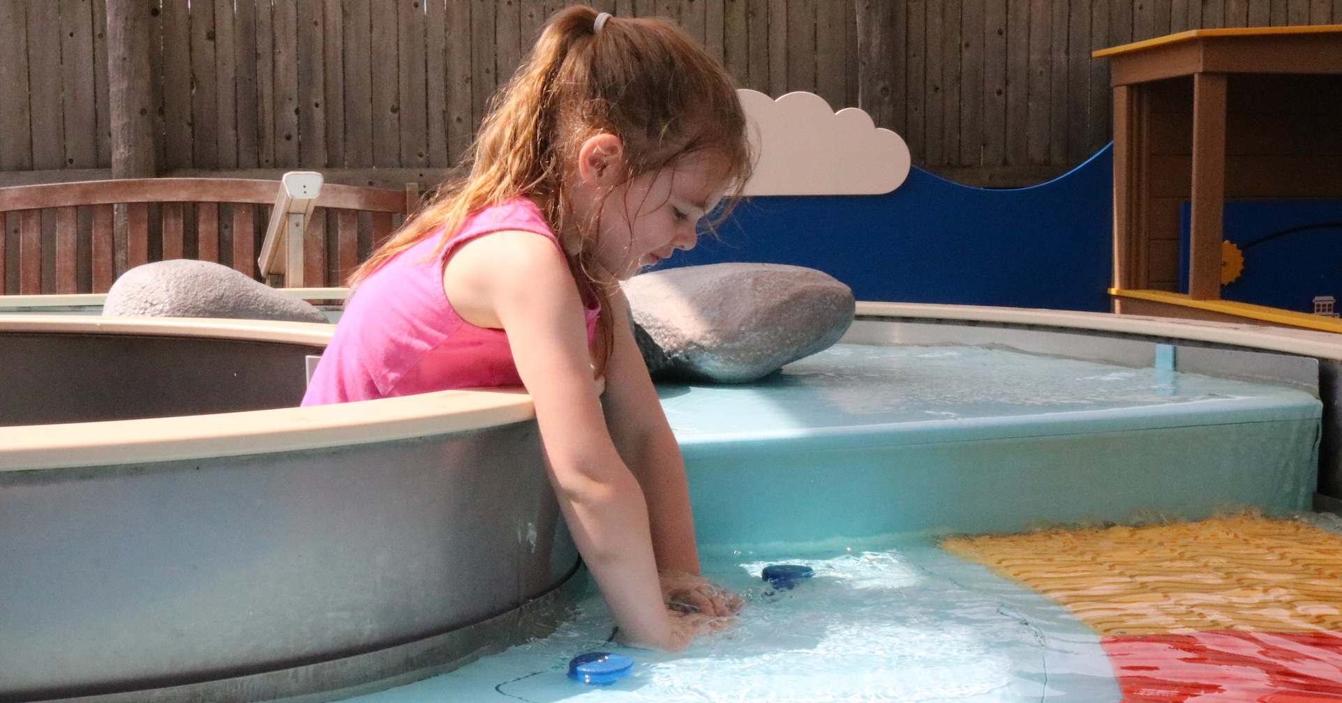Girl playing at splash park