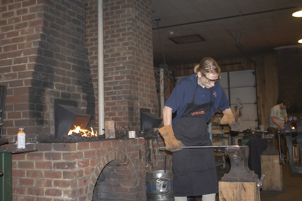 Man hitting steel with a hammer