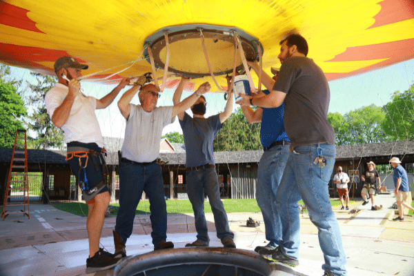 Volunteers helping with hot air balloon deflation