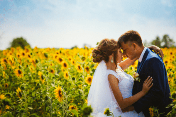 Bride and Groom in Sunflower Field