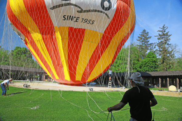 Volunteers helping with hot air balloon deflation