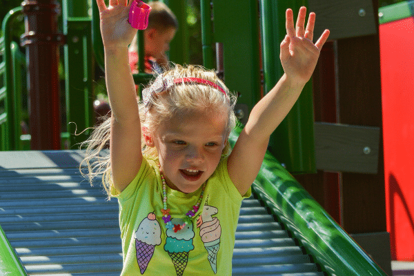 Girl playing on Ag Adventures slide