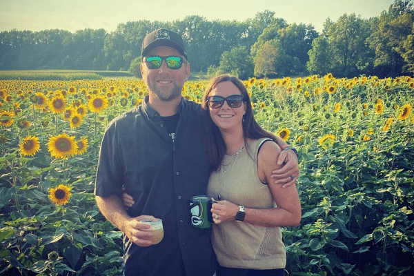 Couple Smiling In Sunflower Fields