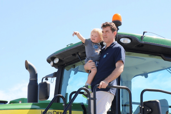 Father And Toddler Son On Tractor