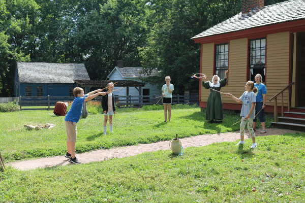 Guests Playing A Game With Prairietown Interpreter