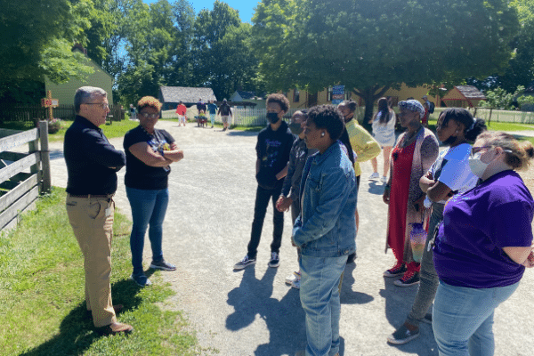President and CEO Norman Burns and Curatorial Director Dr. Charlene Fletcher welcome Academy members and Teaching Artist AshLee Baskin to Prairie Town
