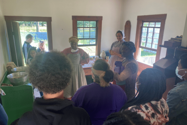 The cast interacting with Historic Interpreters while visiting the Eagle Inn.
