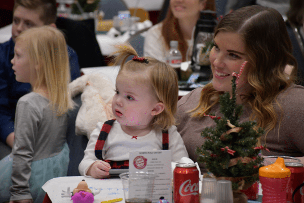 Family listening to Santa telling stories