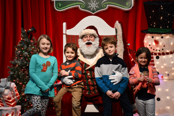 Family listening to Santa telling stories