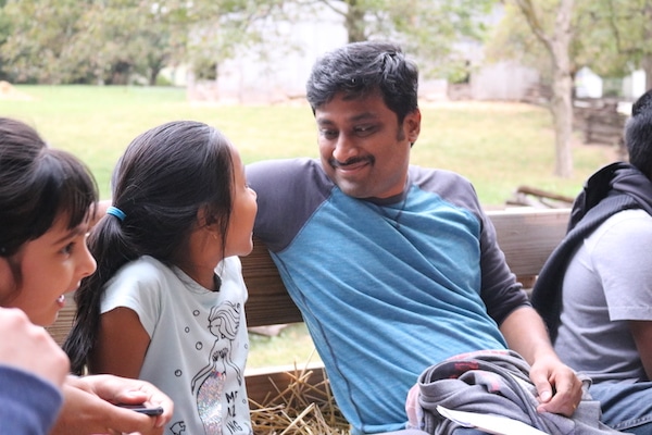 Father and daughter enjoying a hay ride