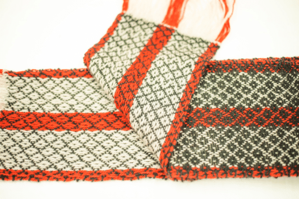 Red, green and white patterned scarf