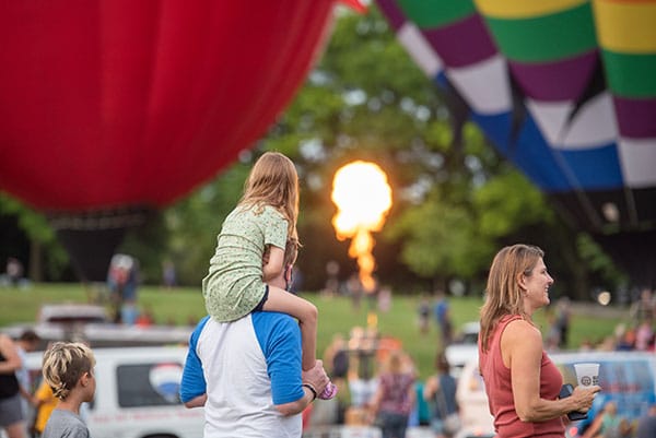 Child and parent at jupiter flights balloon glow
