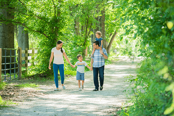 Family of four on nature walk