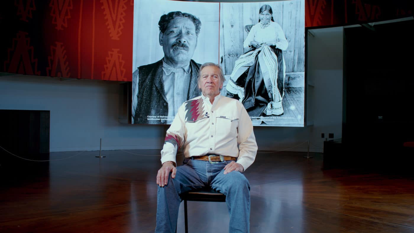 Photo of Mike Pace with his ancestors behind him