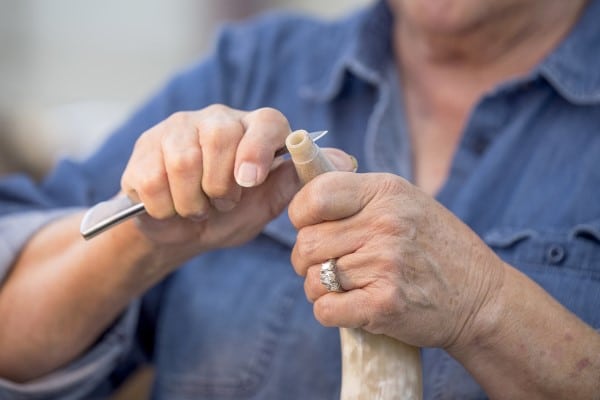 Woman working on a horn