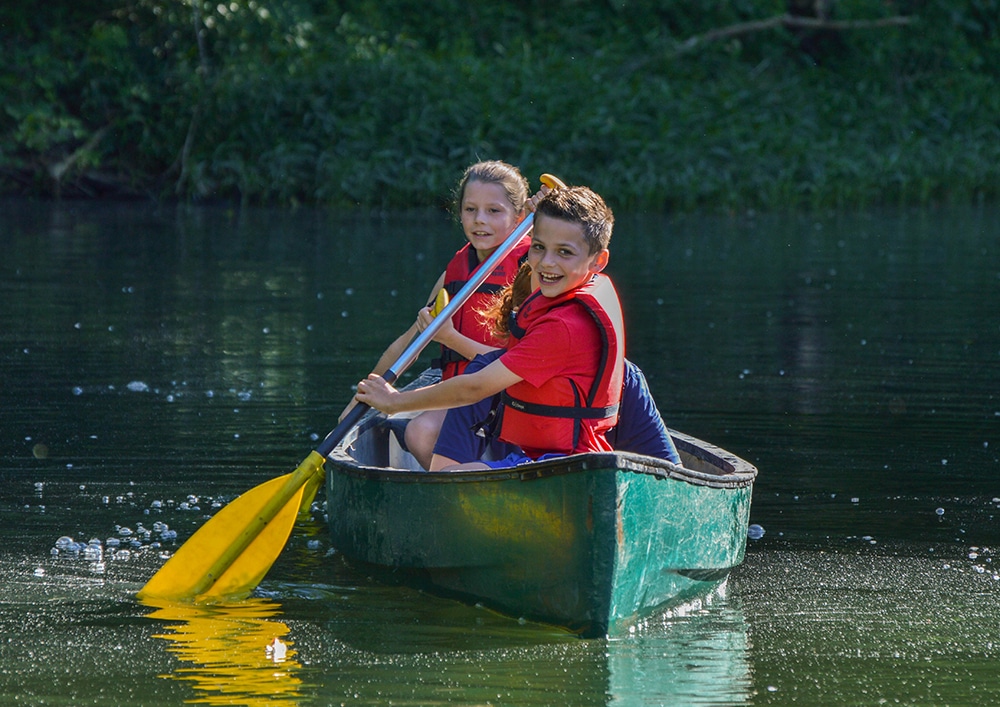 Adventure Camp students in a canoe