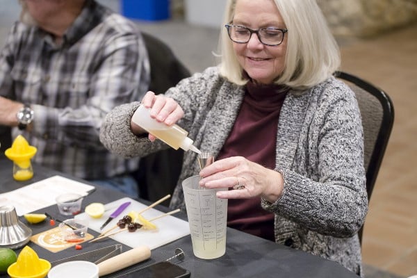 Woman making cocktail