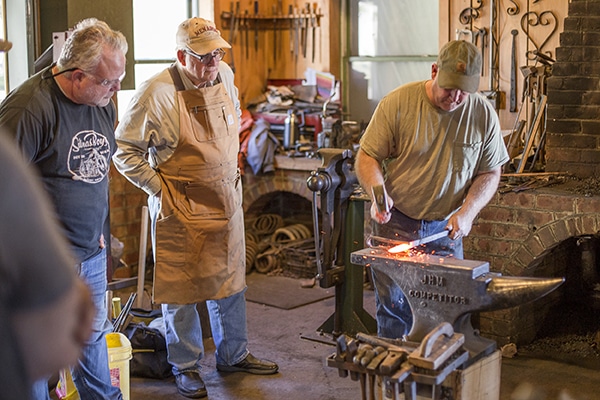 group of people in the forge
