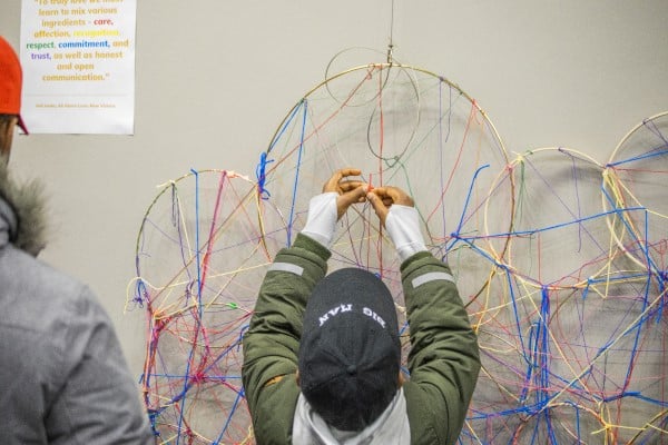 Child adding his string to circles