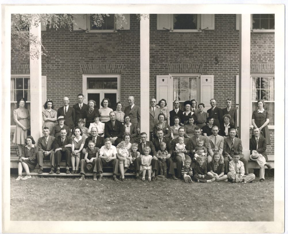 Conner Prairie Farms employees with Eli Lilly in front of the William Conner house from the CPM Archives