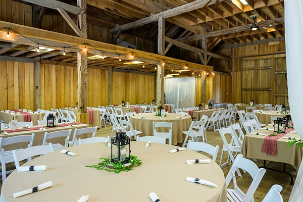 tables set up inside of a wooden building