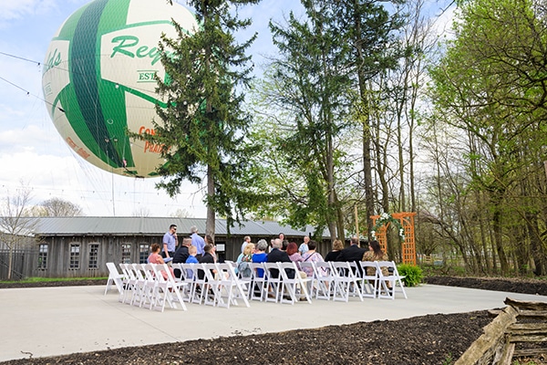 chairs set up outside and balloon voyage in the background