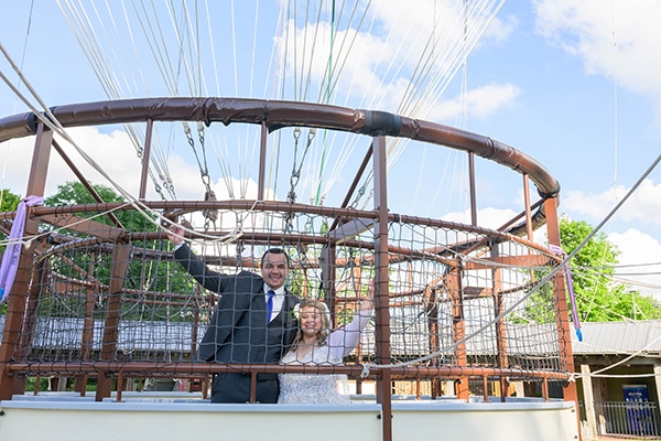 bride and groom in the balloon gondola