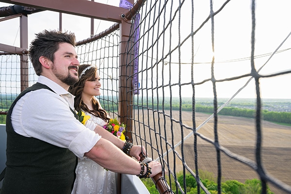 bride and groom in balloon gondola