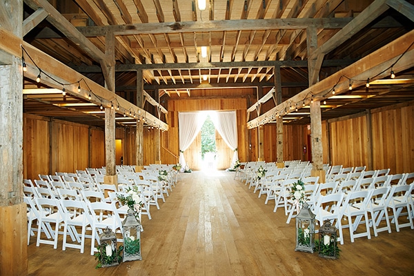chairs set for a wedding in a wooden building