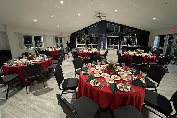 red tables set up inside a building