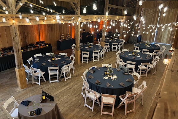 circular tables inside of a wooden building
