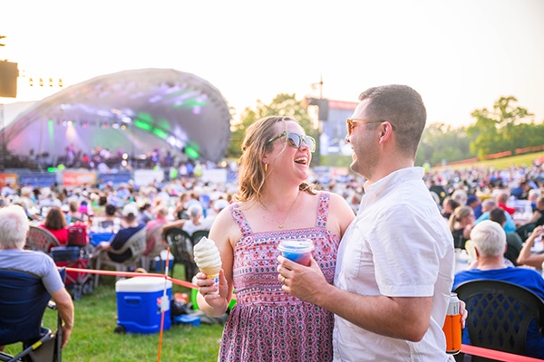 Two adults enjoying Symphony on the Prairie.